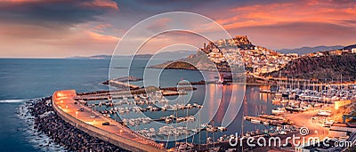 Ð¡harm of the ancient cities of Europe. Panoramic evening cityscape of Castelsardo port. Stock Photo